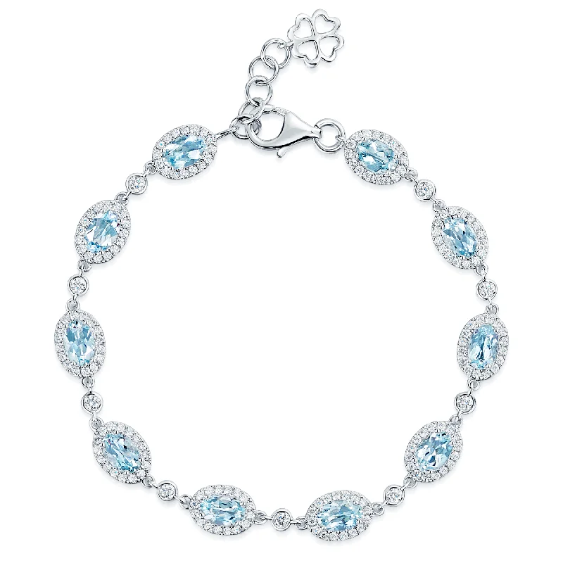 Boho Chic Bracelets-18ct White Gold Oval Cut Aquamarine And Diamond Halo Surround Bracelet